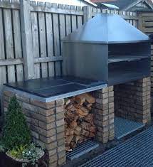 a brick bbq grill in stainless steel