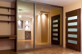 Classic wardrobe with mirrors, with internal drawers. Sliding Wardrobes Doors Designs