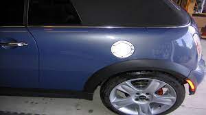 Most fuel caps have a built in mechanism that will cause them to click once they are adequately tightened. Mini Cooper 2001 2006 How To Replace Fuel Door Or Change Flush Door For Chrome Cap Northamericanmotoring