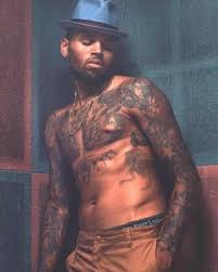 His tattoo is a sugar. Chris Brown Tattoos Meanings A Complete Tat Guide Chris Brown Tattoo Chris Brown Art Chris Brown Shirtless