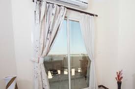 hanging curtains over a sliding glass