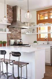 White Kitchen With Brick Accent Wall