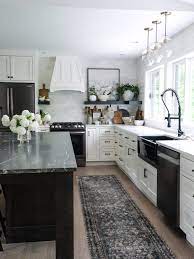 white kitchen with a dark island