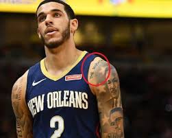 So, he has there tattoos like prying hands, an angel and the words born 2 ball. Lonzo Ball S 24 Tattoos Their Meanings Body Art Guru