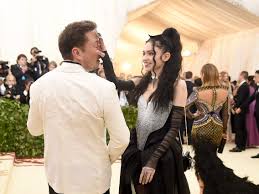 Elon musk and grimes attend the heavenly bodies: Elon Musk And Grimes Relationship From How It Began To Their New Baby Business Insider