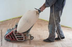 sanding hardwood floor with the