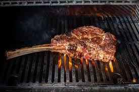 grilled tomahawk steak and sides