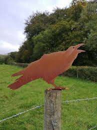 Rusty Metal Cawing Crow Fence Post
