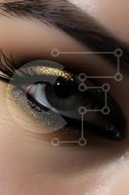 black eyeliner and gold glitter