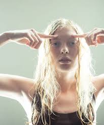 albino woman with wet blond long hair