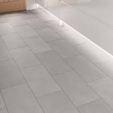 Each piece of stone is a unique creation of the earth, making every flooring application one of a kind. Tenacity Light Grey Engineered Stone Tile Flooring With Pre Attached Net Underlay 2 131m Pack Howdens