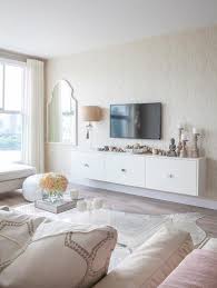 Lacquer is about the easiest finish to touch up that exists so you are not going to gain much by switching to some other finish. White Lacquer Floating Media Cabinet Transitional Living Room