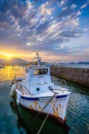 Ls underground isn't your run of the mill deck builder. Fishing Boat In Port Of Naousa On Sunset Paros Lsland Stock Photo Crushpixel