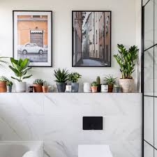 The natural stone countertop is just a little grayer than the white vanity, which makes a nice transition between the tile wall and the rest of the space. Bathroom Tile Ideas Wall And Floor Solutions For Baths Showers And Sinks