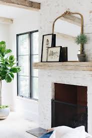 Painted White Brick Fireplace With Gold