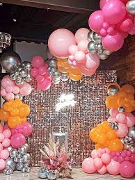 hot pink and orange balloon garland
