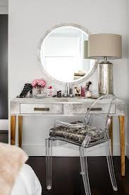 round silver mirror with silver makeup