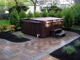 This little backyard oasis comes with a wood fired heater, a storage nook and a shed where you can store the wood for heating your hot tub, as well as the hot tub itself. Create Low Maintenance Landscaping Around The Hot Tub And Relax More Add Our Long Lasting Rubber Mulch With Hot Tub Landscaping Hot Tub Patio Hot Tub Backyard