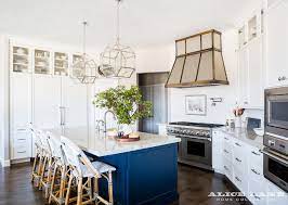 white kitchen with navy blue island
