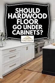 should hardwood floor go under cabinets