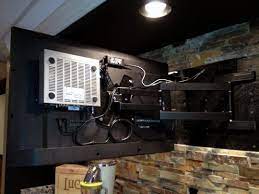 hide cable box behind wall mount tv