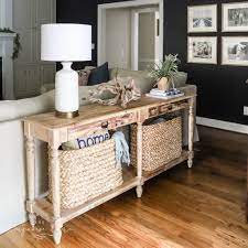 console table behind a couch