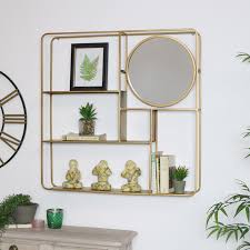large gold multi shelf mirrored wall