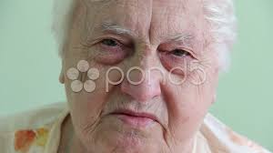 sad face of an old woman stock video