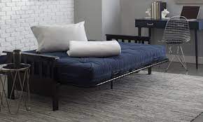The cheap frames many futons come with don't provide adequate support for a sagging mattress. 6 Tips To Make A Futon Bed More Comfortable Overstock Com