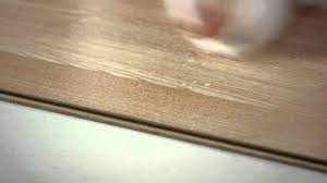 remove white film on laminate flooring