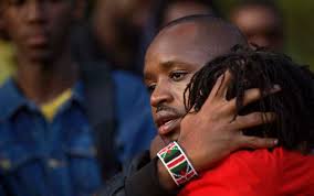Image result for President Uhuru with a kenyan flag wrist band