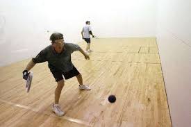 In racquetball, players play with bigger stringed racquet heads, and a bouncier but larger than a squash ball, on a longer but narrower court. Racquetball Local Racquetball Picking Up Steam Local Sports Rapidcityjournal Com