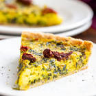 vegan quiche with mushrooms and shallots and a herb crust