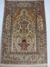 fine silk hereke rug with signature