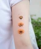 What do sunflower tattoos represent?