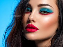 beautiful young woman with blue makeup