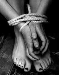modern day slavery in so a so a and so land missing kidnapped abused hostage victim w hands and legs tied up