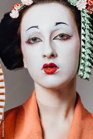woman in geisha makeup and a