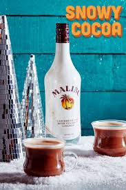 Malibu is based on rectified white barbados rum blended with natural coconut extracts and presented in a iconic opaque white bottle with the palm tree logo. Malibu Snowy Cocoa 1 5 Parts Malibu 2 5 Parts Hot Chocolate 5 Part Condensed Milk Glass Heat Resistant Glass Malibu Drinks Christmas Drinks Holiday Drinks