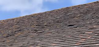the dangers of a slipped roof tile