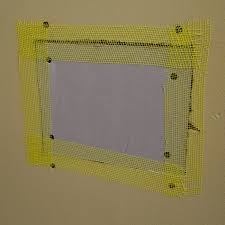 Drywall Patch With Mesh Tape Around The
