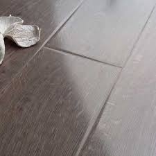 Bring the beauty of a solid hardwood floor to your home. Prestige Gloss Grey Oak 8mm V Groove Laminate Flooring
