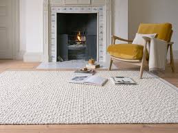 pebble floor rug in natural hand