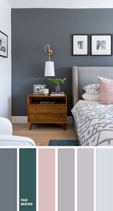 grey bedroom with pink and teal accent