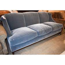 a rudin blue three cushion sofa