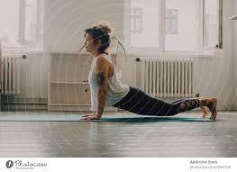 calm woman practicing yoga pose and