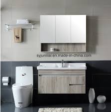 31 inch glossy white bathroom vanity with fitted ceramic sink, wall mounted, lighted mirror included. China European Style Washroom Modern Bathroom Vanity China Led Mirror Plywood Cabinet