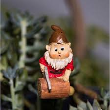 miniature garden gnome holding chainsaw