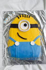 Then, roll yellow fondant over the majority of the cake and use blue fondant to create the jumper and straps. How To Make A Minion Cake House Of Treats