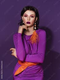 bright color makeup in a purple dress